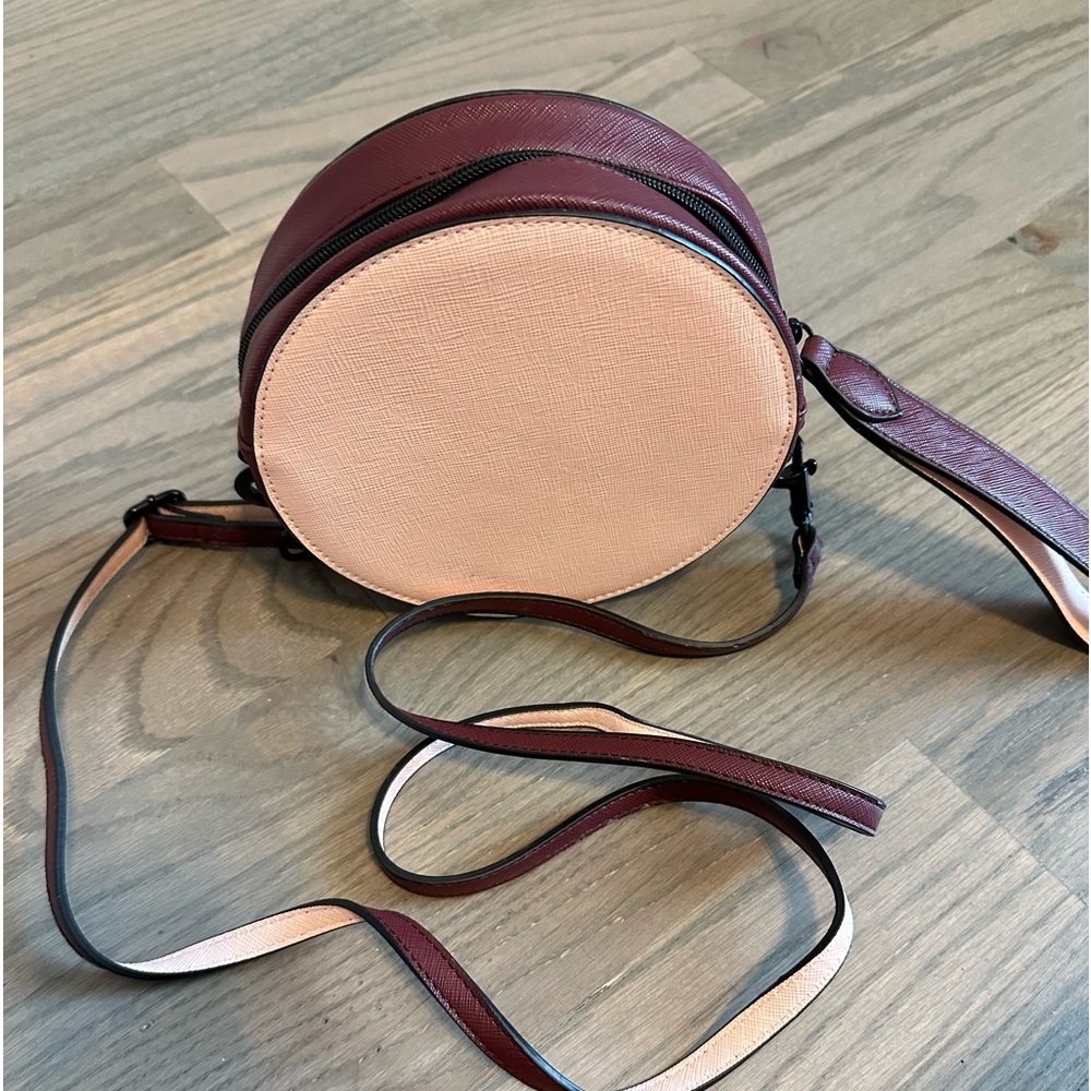 Circle crossbody bag, extra long adjustable strap, burgundy and pink.